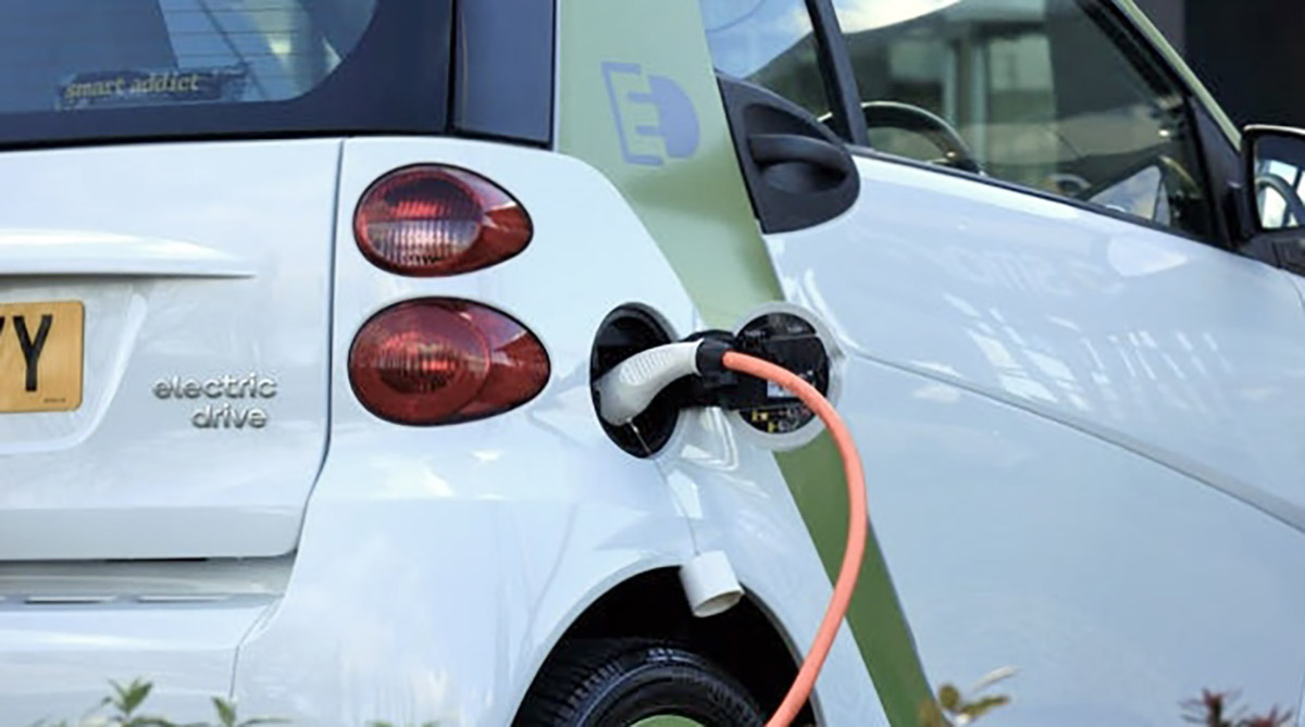an electric vehicle plugged into a power source