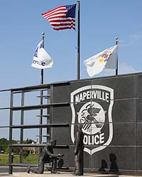 Flags fly behind NPD's Police Officer Memorial