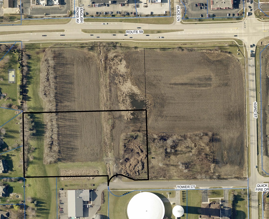 an aerial view of the property to be developed with the parcel in question outlined