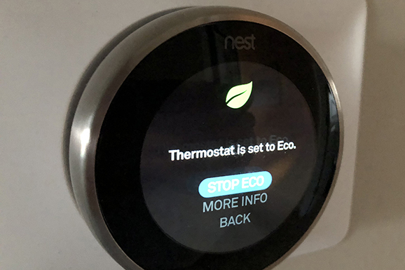 a smart thermostat affixed to a wall