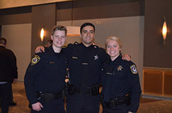 Three uniformed officers from NPD's Internship Program that recently graduated from the Police Training Institute