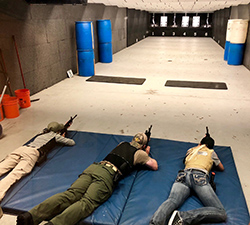NPD interns train with rifles in the firearm range